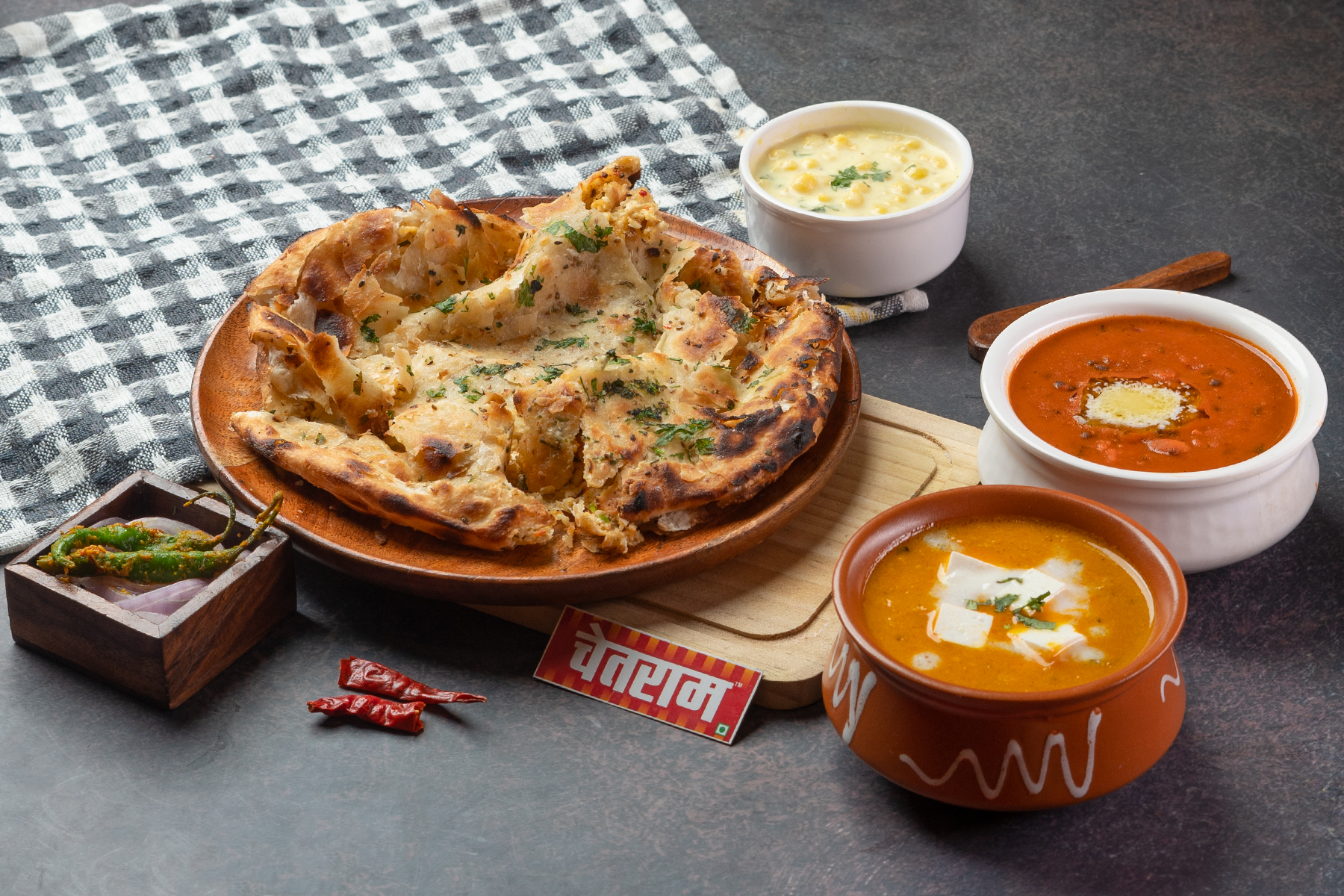 Chur Chur Naan served as a complete thali with Dal Makhani and Shahi Paneer